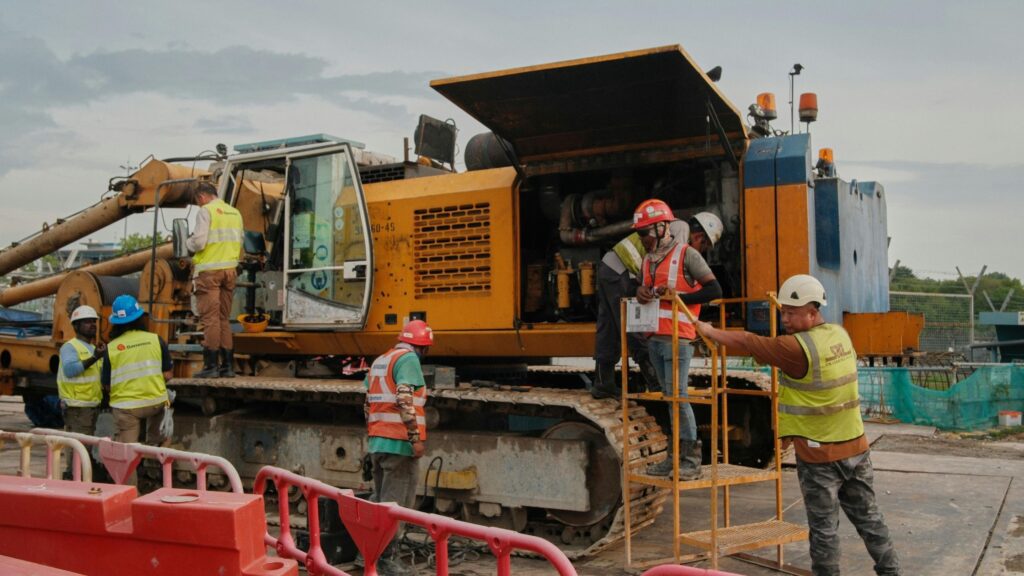 Expert analyzing equipment failure on excavator involved in workplace accident