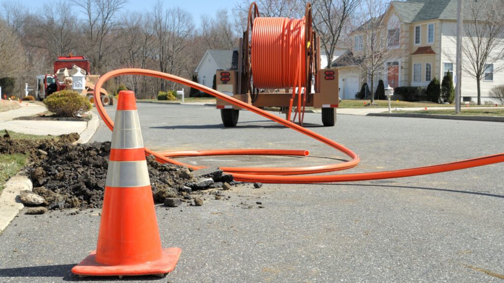 Diagram of underground utilities intersecting with trenchless drilling path showing potential damage points
