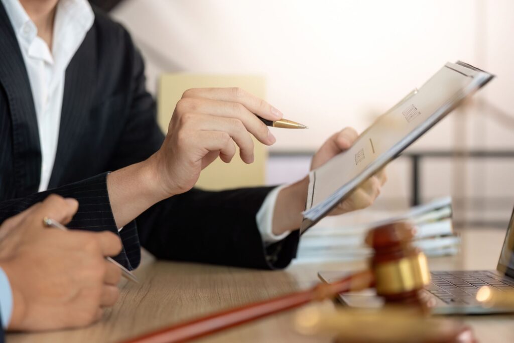 Expert witness reviewing heavy equipment documentation during construction dispute resolution.