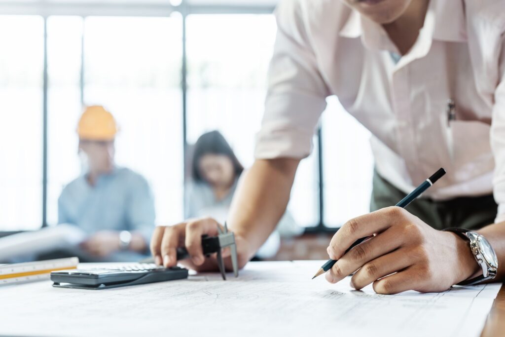 Close-up of forensic engineer analyzing damaged construction equipment component