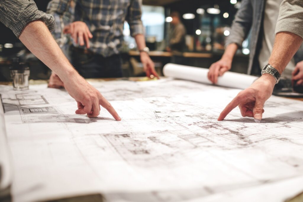 Expert witness analyzing construction traffic control plans on-site