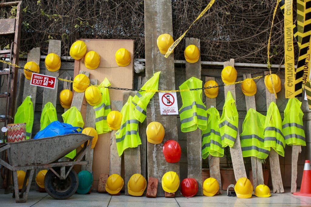 Civil and underground construction work zone with safety signage and workers following OSHA compliance standards