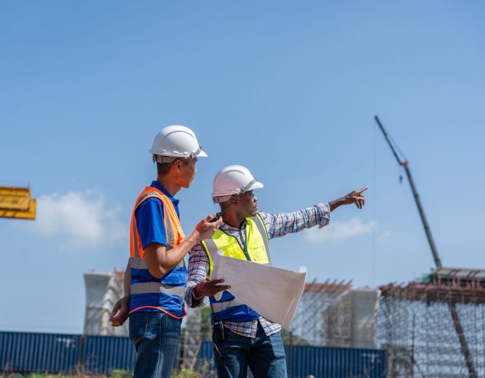 Excavator operating near easement boundary during construction project analyzed by Discovery Experts.