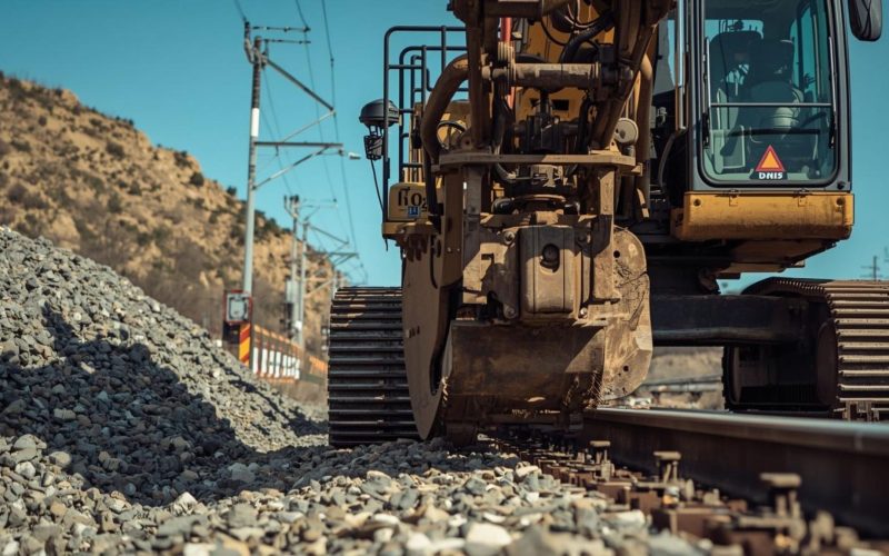 Railroad right-of-way dispute involving heavy equipment excavation near active rail line