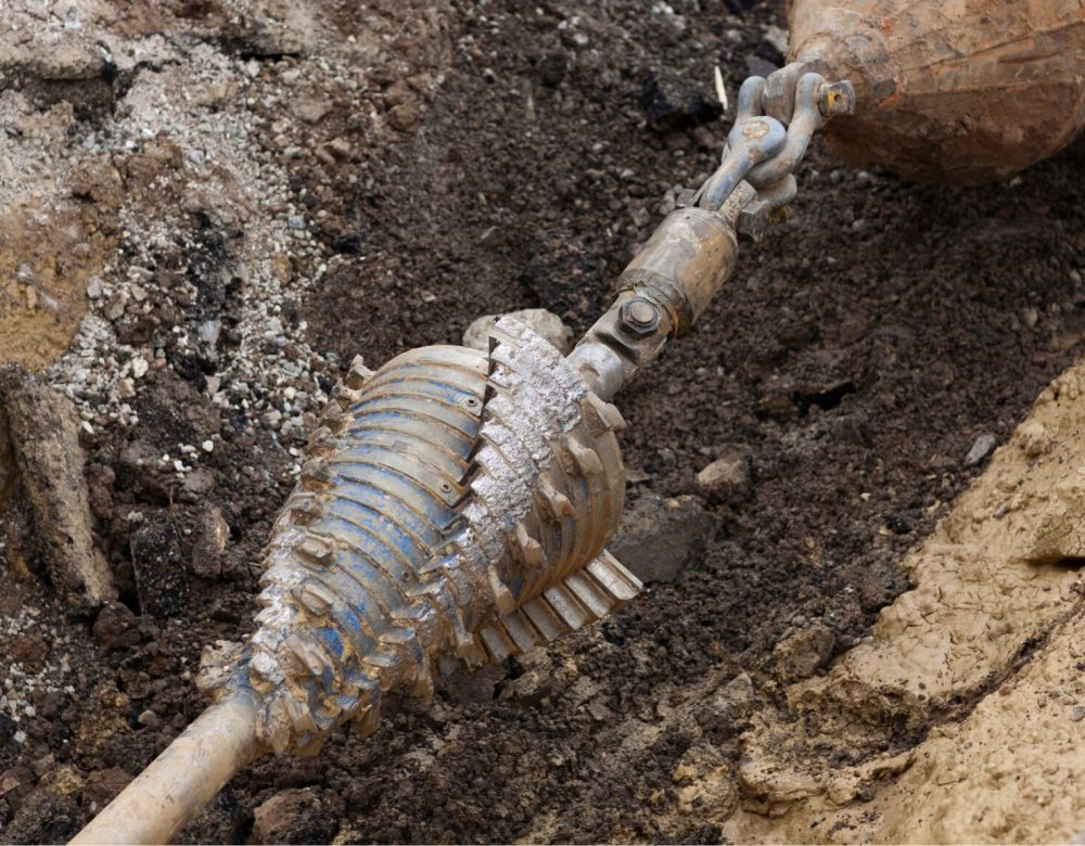 Trenchless construction team using HDD equipment near utility lines during infrastructure project
