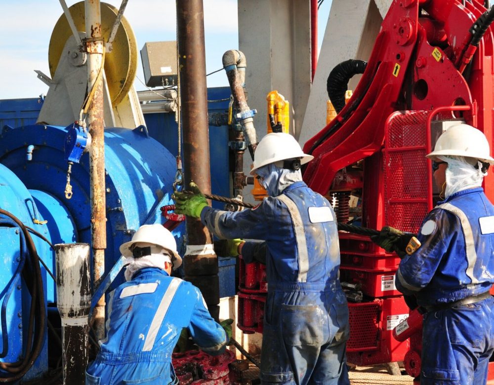 Trenchless construction crew performing horizontal directional drilling on a utility project
