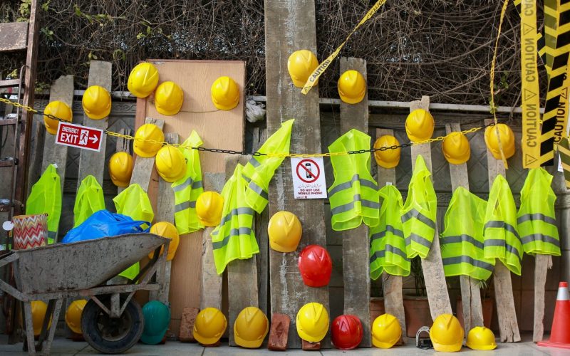 Civil and underground construction work zone with safety signage and workers following OSHA compliance standards